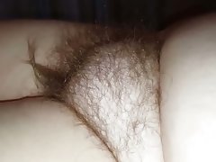 Curling the hair on her hairy bush