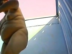 Fat chick gets naked to try on some